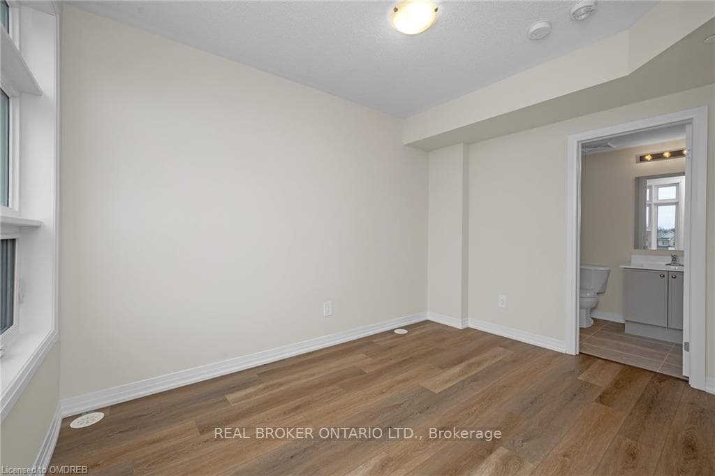bdrm w/connected bth, light wood-style flr.