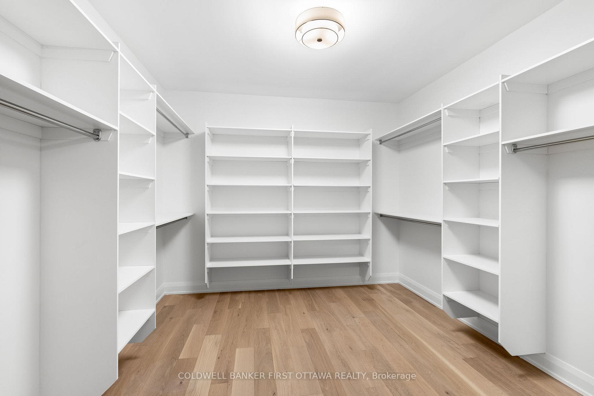 Custom primary bedroom walk in closet.