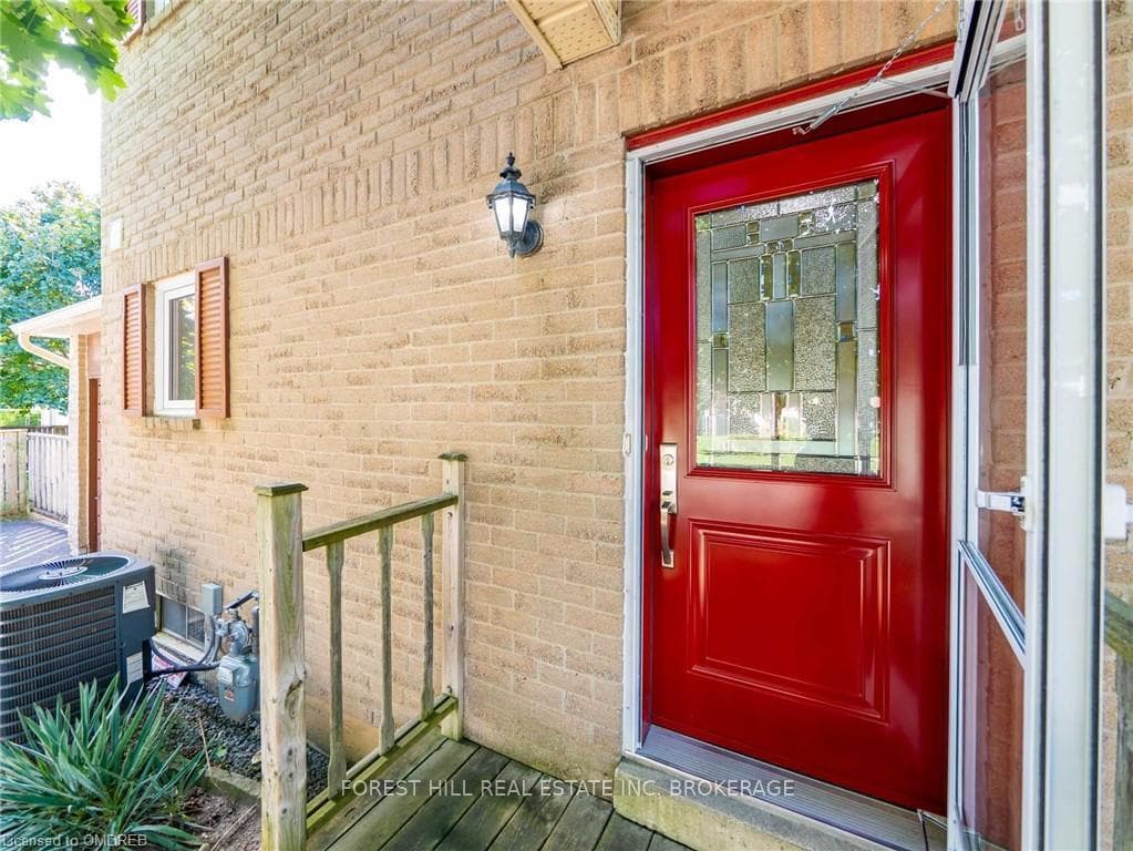 View of exterior entry featuring central AC