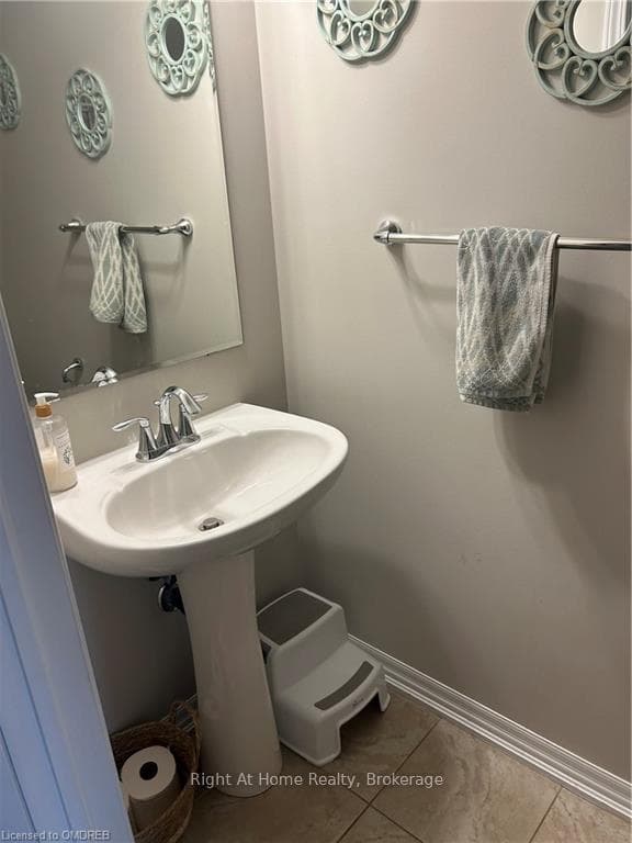 Bathroom with tile patterned flooring