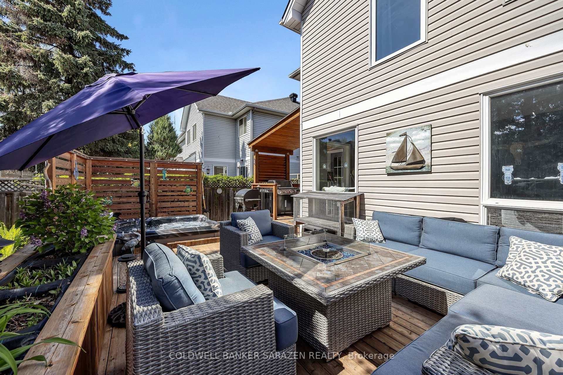 Large deck with seating area & privacy screens