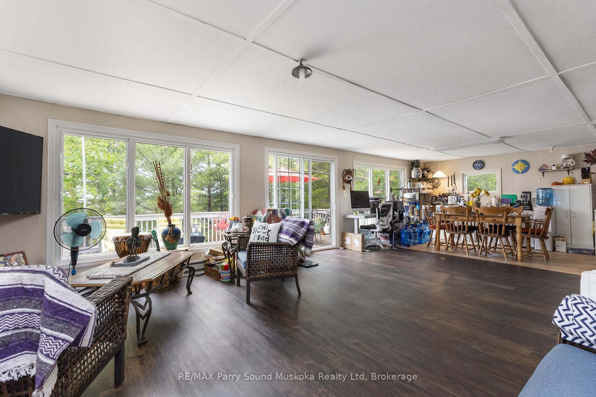 Wall of windows with walkout to deck