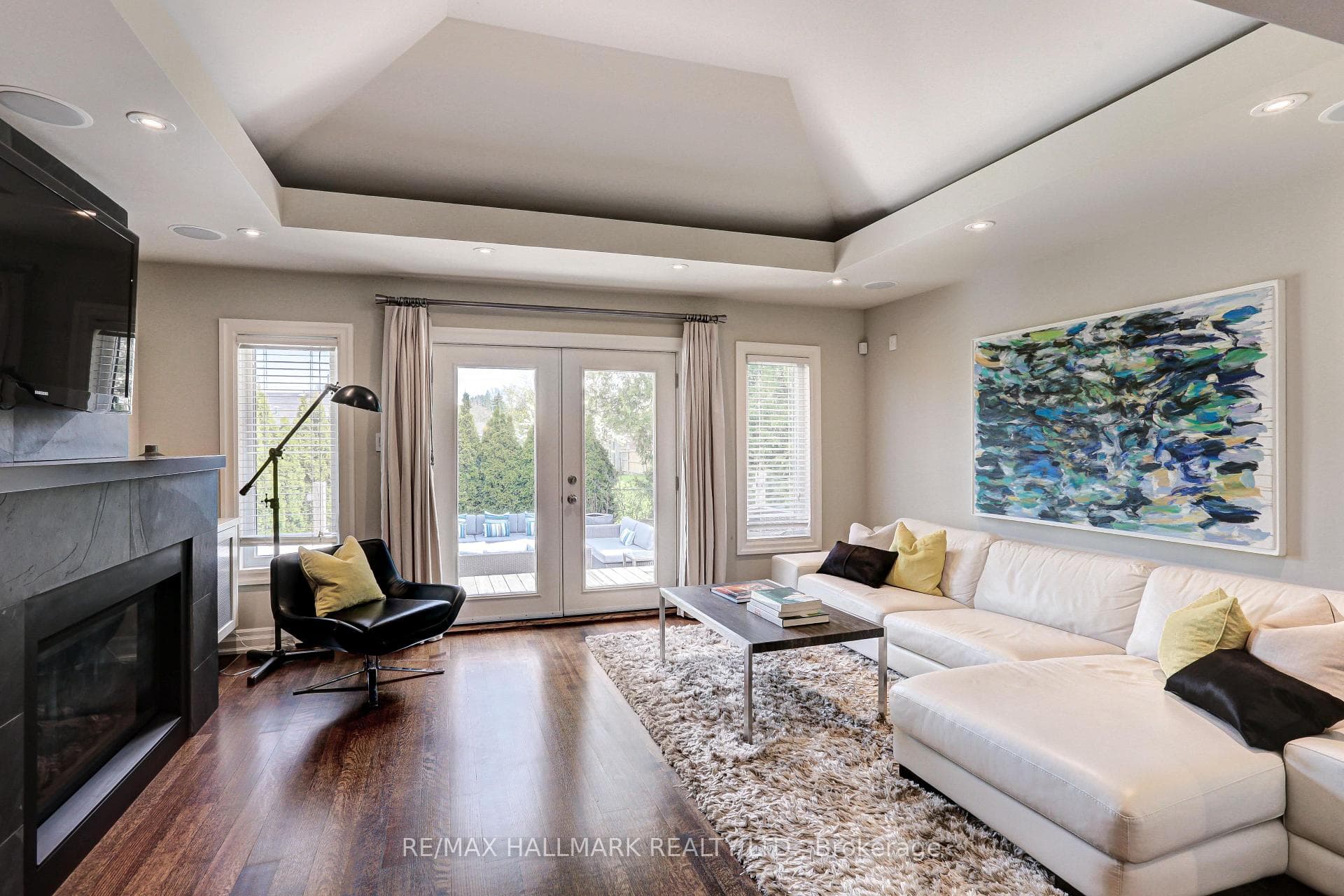 The living room overlooks tiered decks and gardens