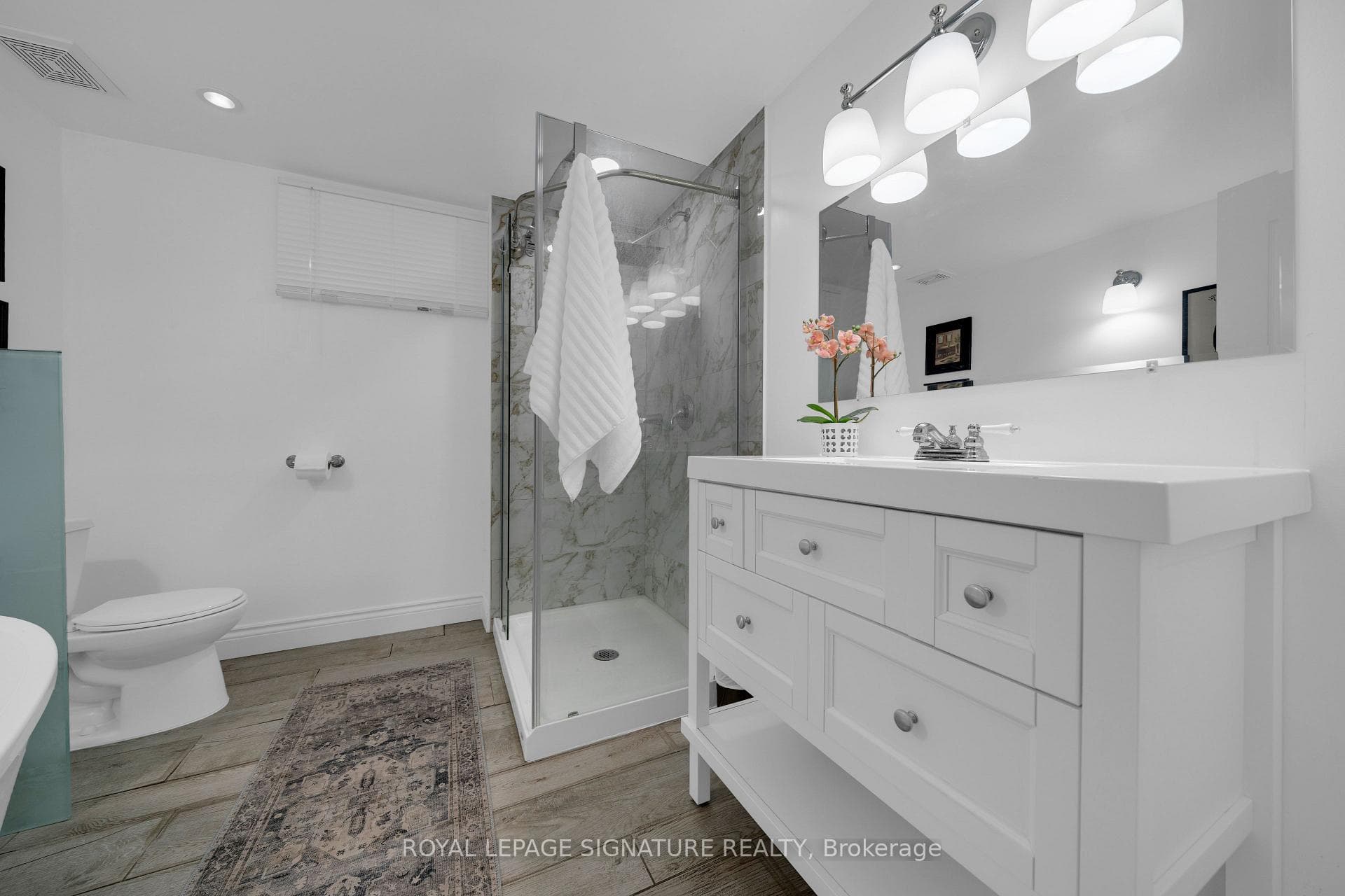 Spacious Basement Bathroom with Tiled Shower