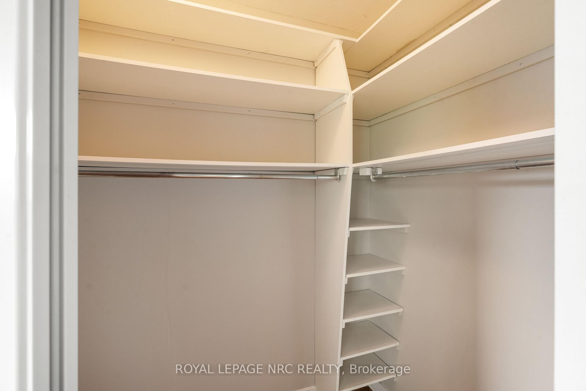 Primary bedroom walk-in closet