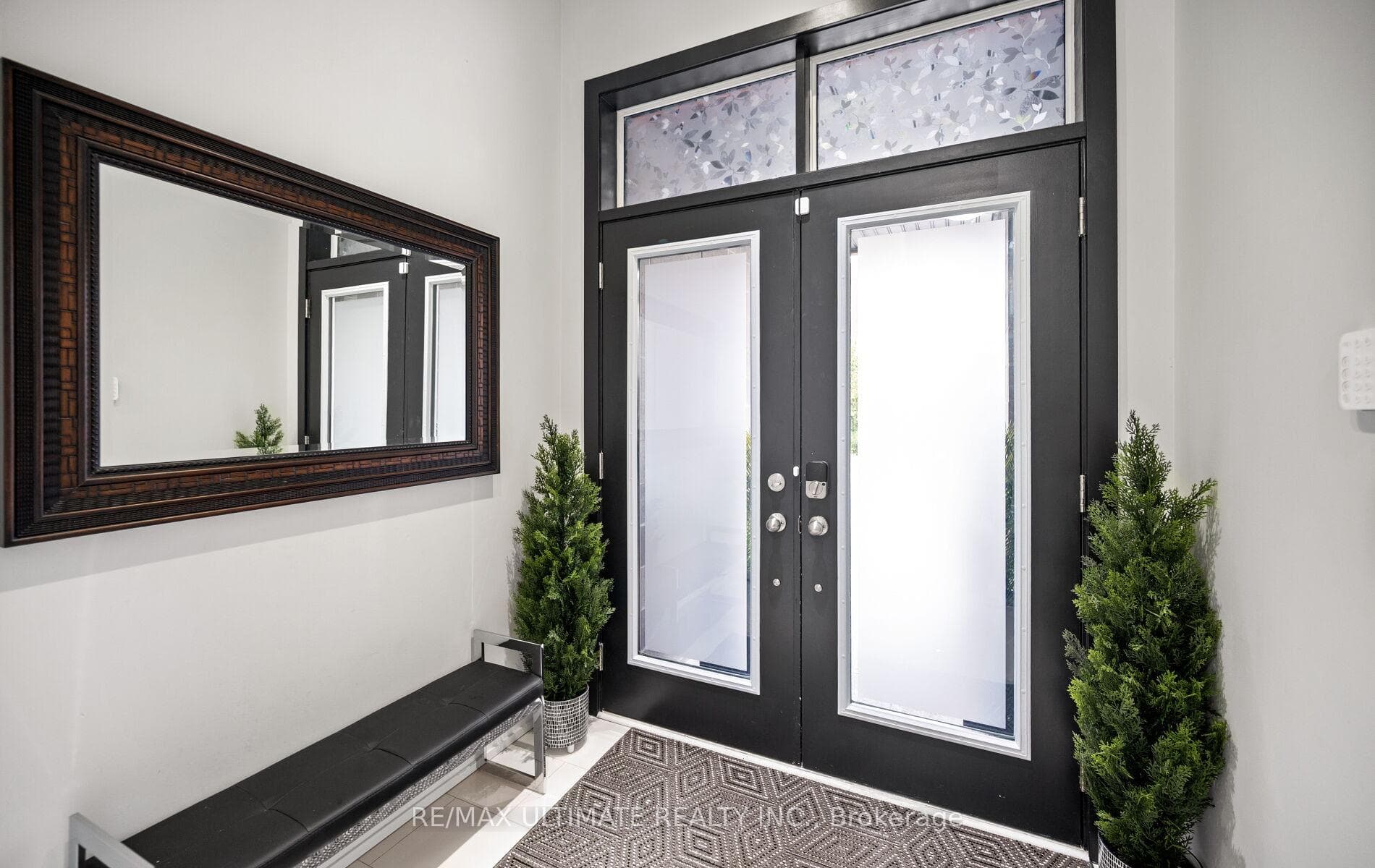 Double doors and spacious foyer