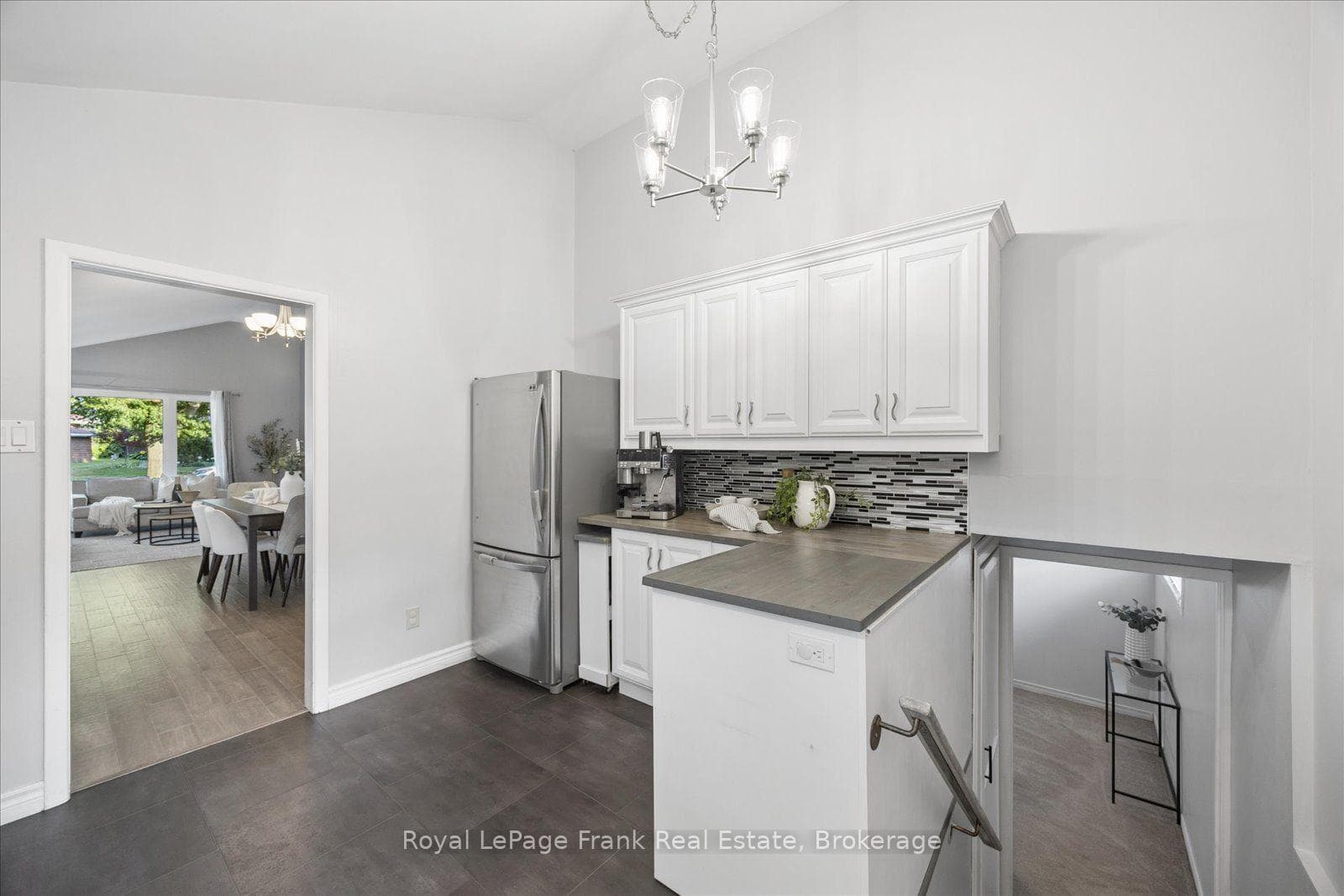 Door in Kitchen Leads to Stairs to the Lower Level