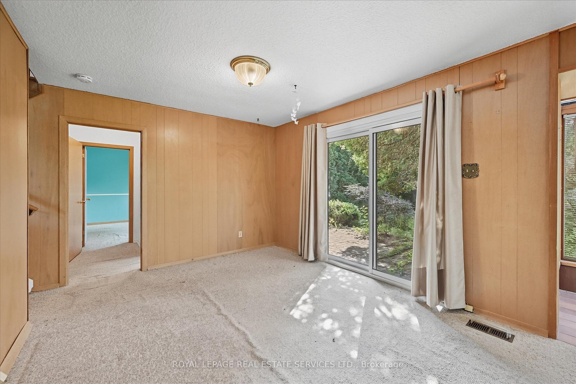 Sliding Door Walkout from Family Room to Backyard