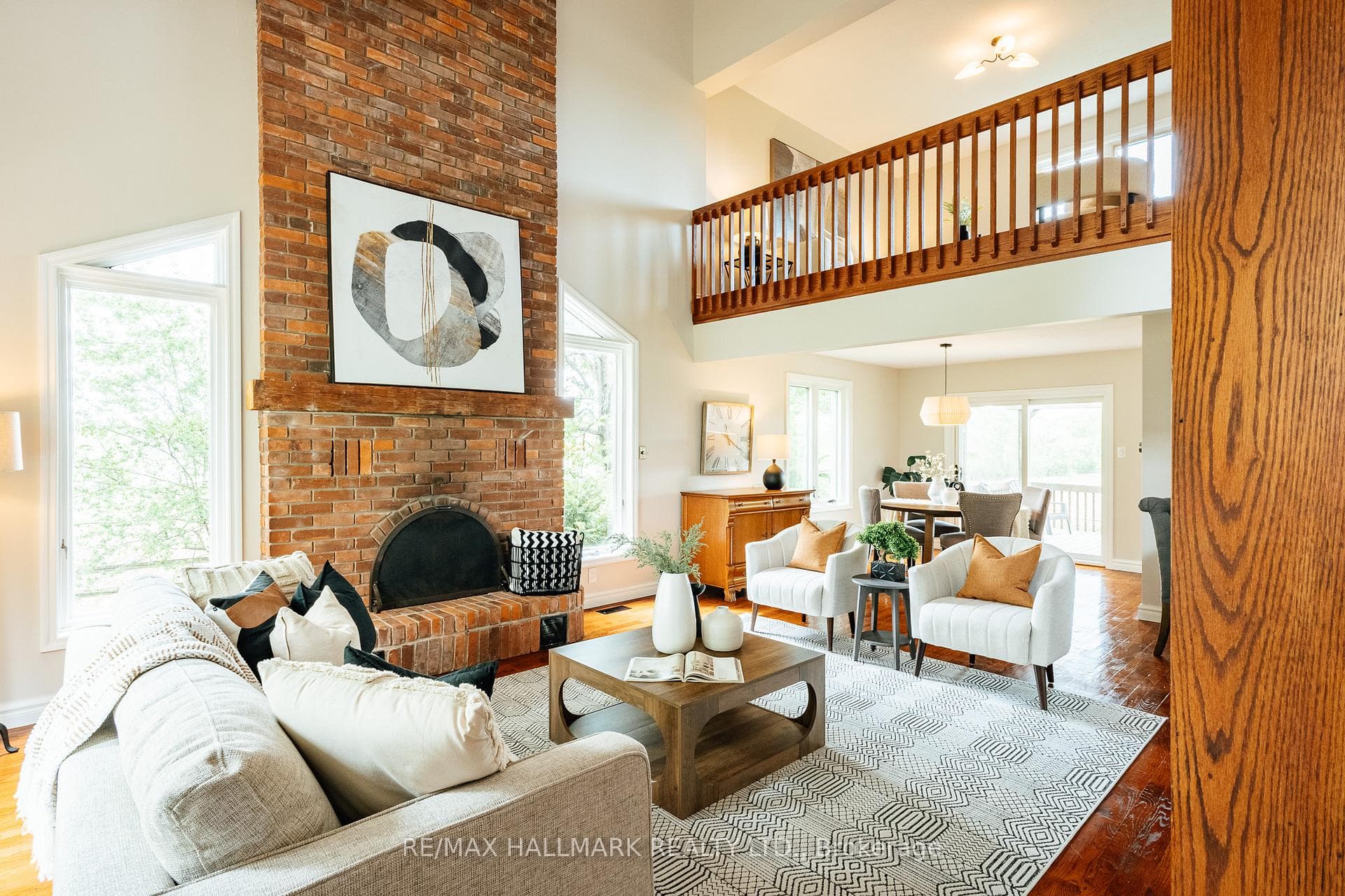 open living and dining with majestic fireplace