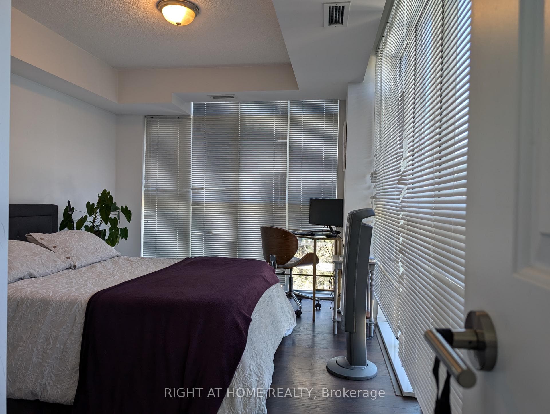 windows facing north and west in bedroom