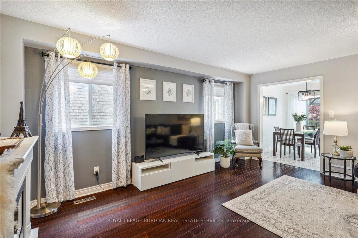 Bright and spacious living room with hardwood.
