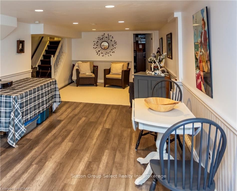 Dining space with hardwood / wood-style floors