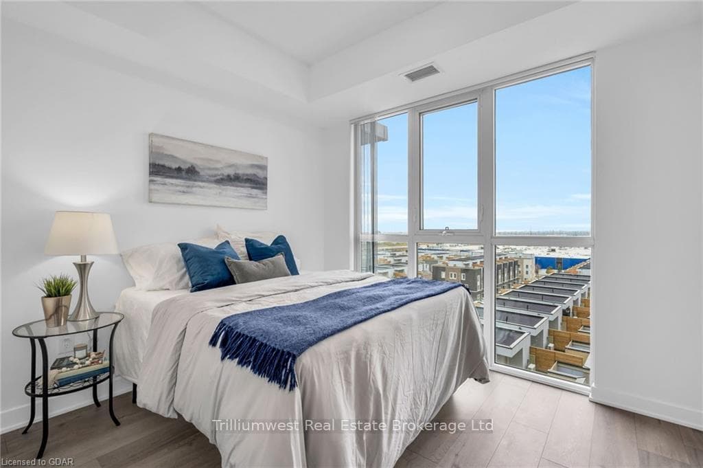 Bedroom with hardwood / wood-style flooring