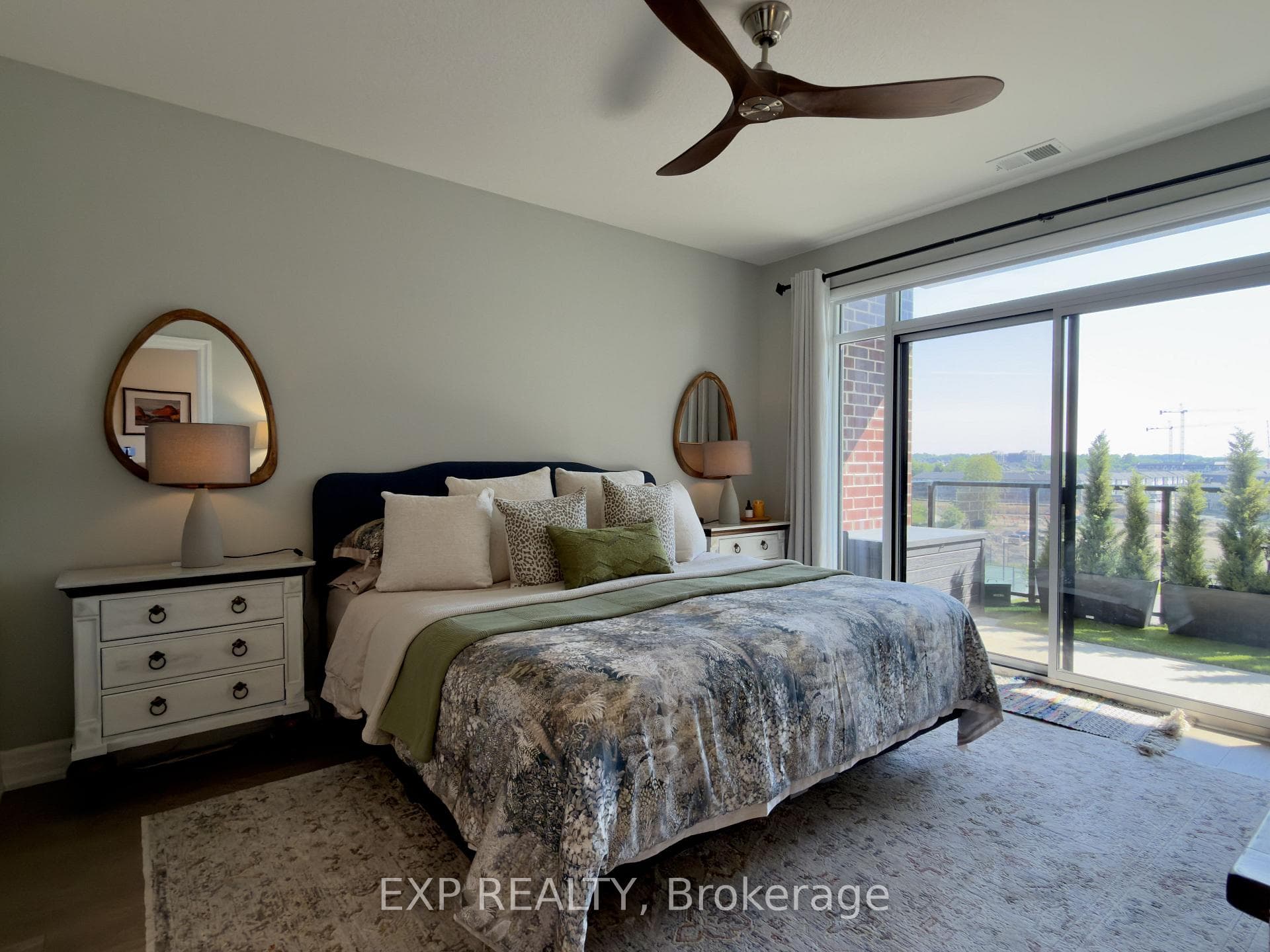 Sunlit Primary Bedroom room with balcony access.