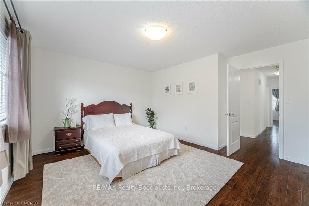 Bedroom featuring dark hardwood / wood-style floor