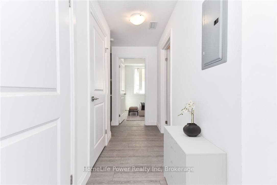 Hallway wood-finish flooring (Virtually Staged)