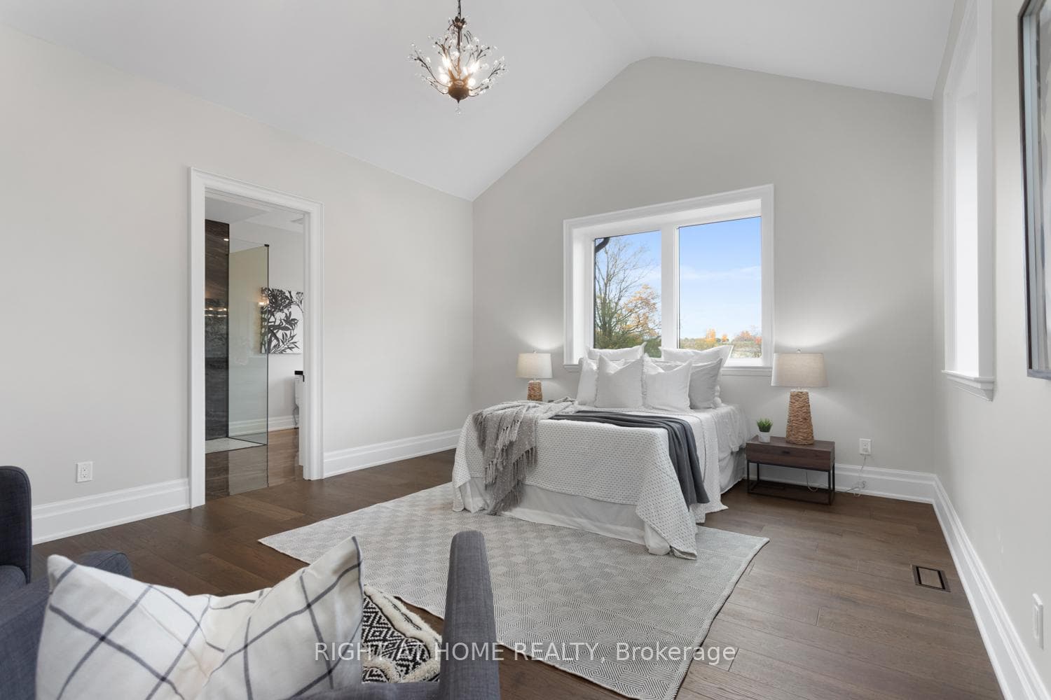 Primary bedroom with cathedral ceiling