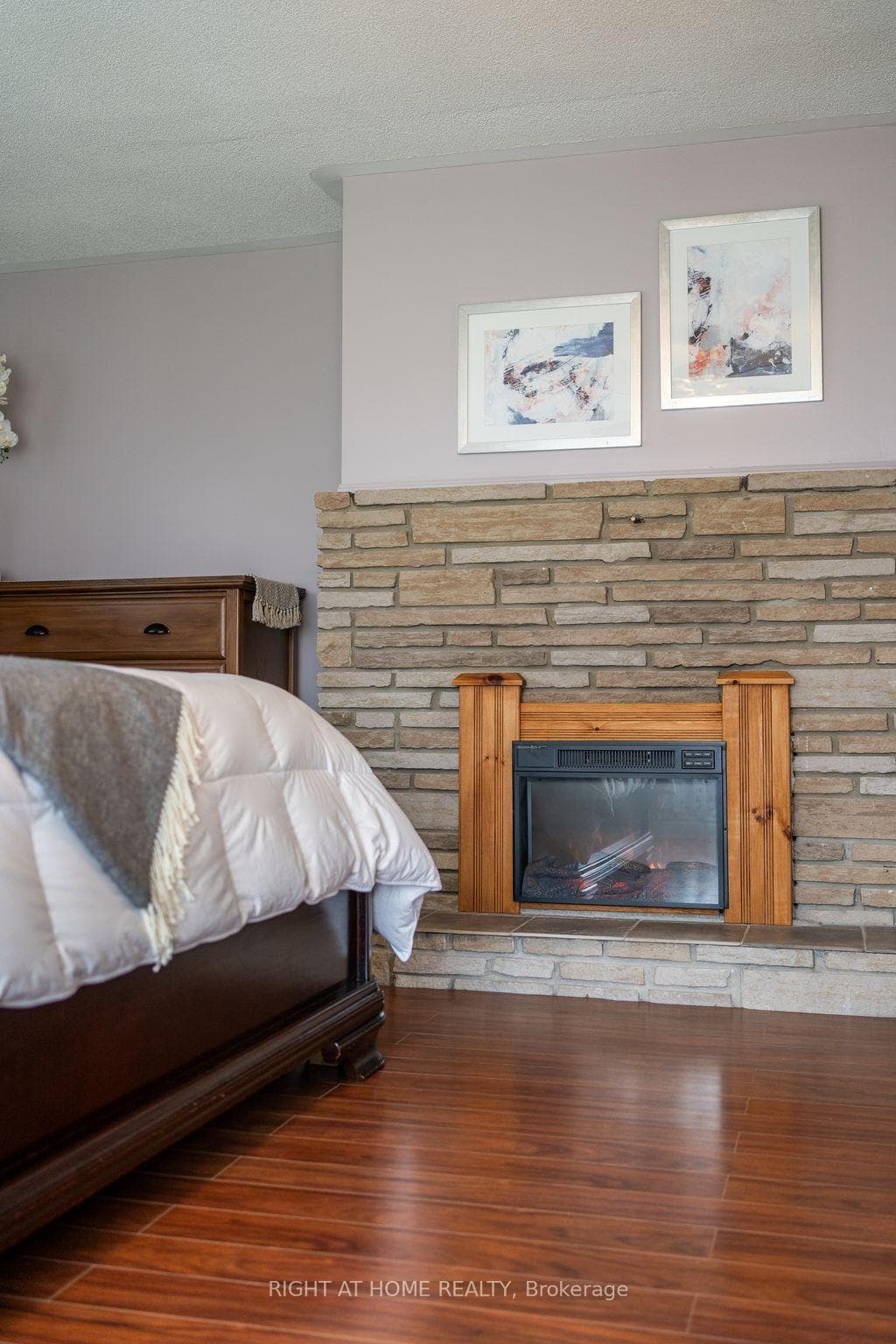 Cozy Fireplace Ambience in Primary Bedroom