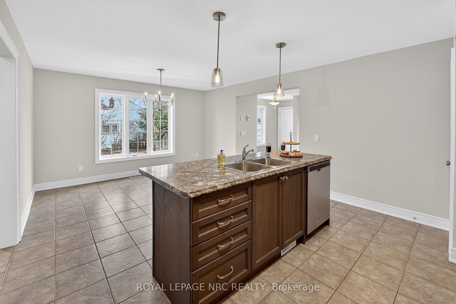 KITCHEN ISLAND OVERLOOKS THE DINING AREA