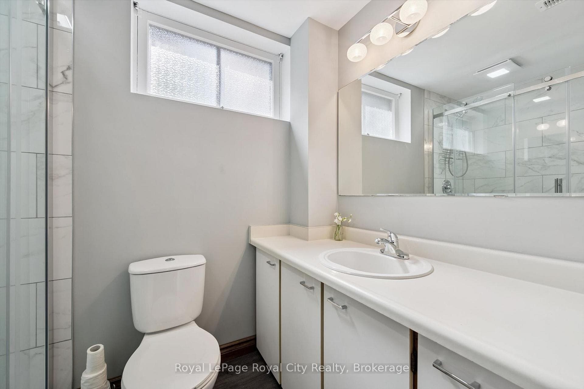 3pc bath-- new walk in shower seen in mirror