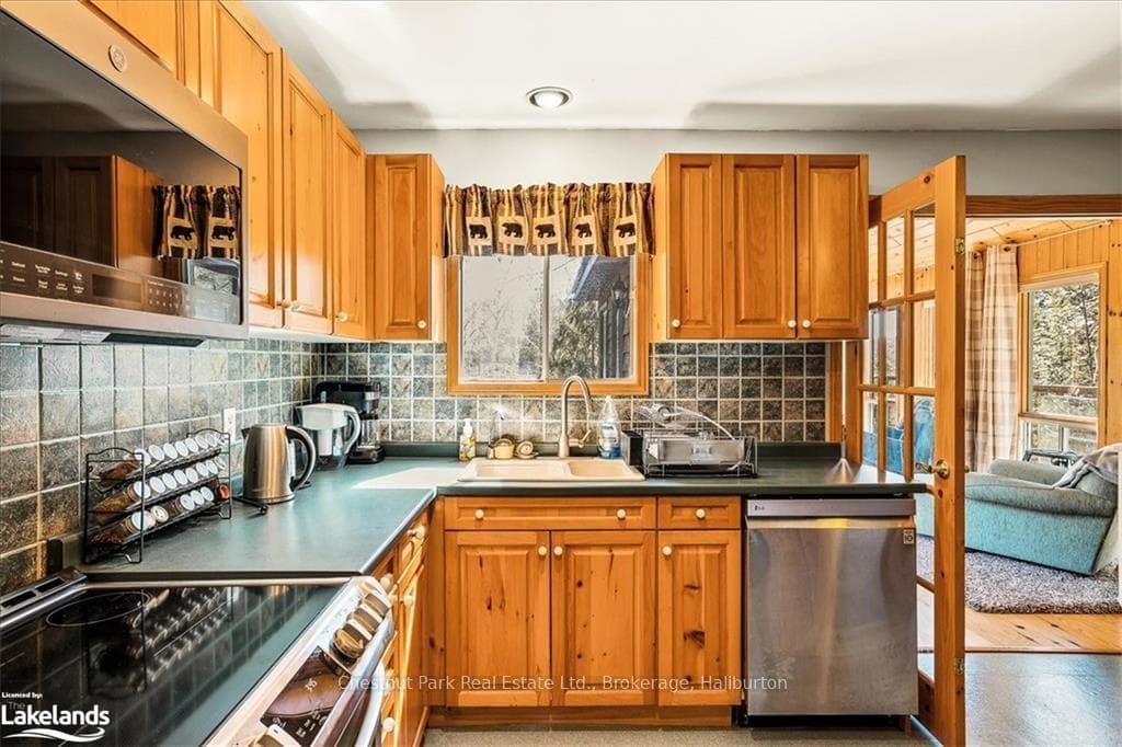 Kitchen Sits Next to Sunroom