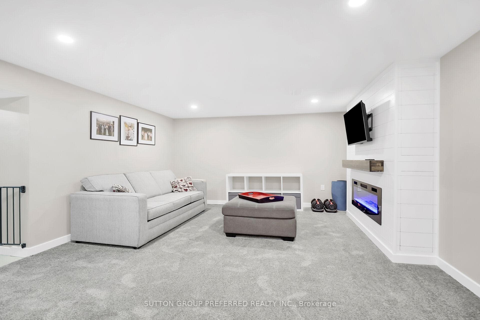 Family room with new carpet and electric fireplace