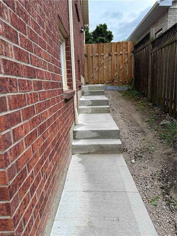 New concrete sidewalk and stairs to the new apartm