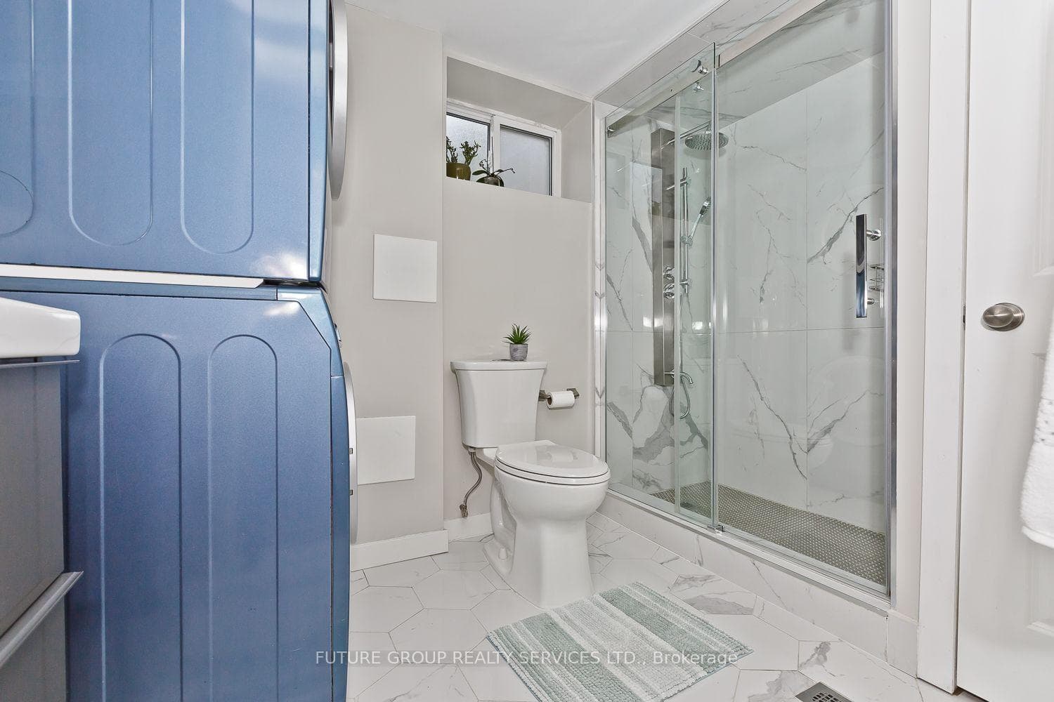 Washroom in Basement with washer and dryer