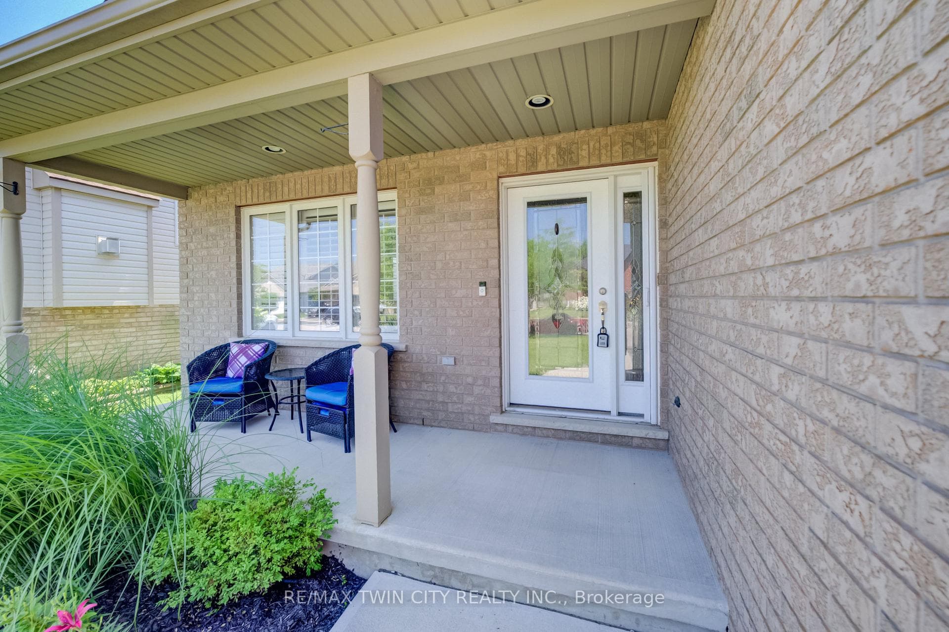 Welcoming glass door and covered porch
