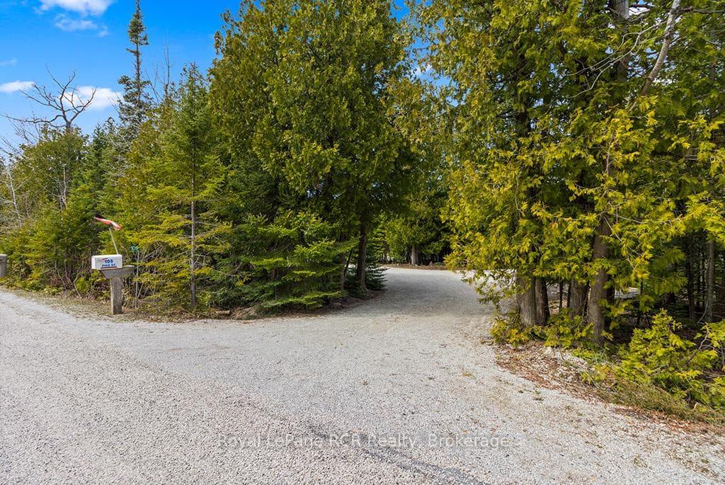 Winding driveway entry providing complete privacy.