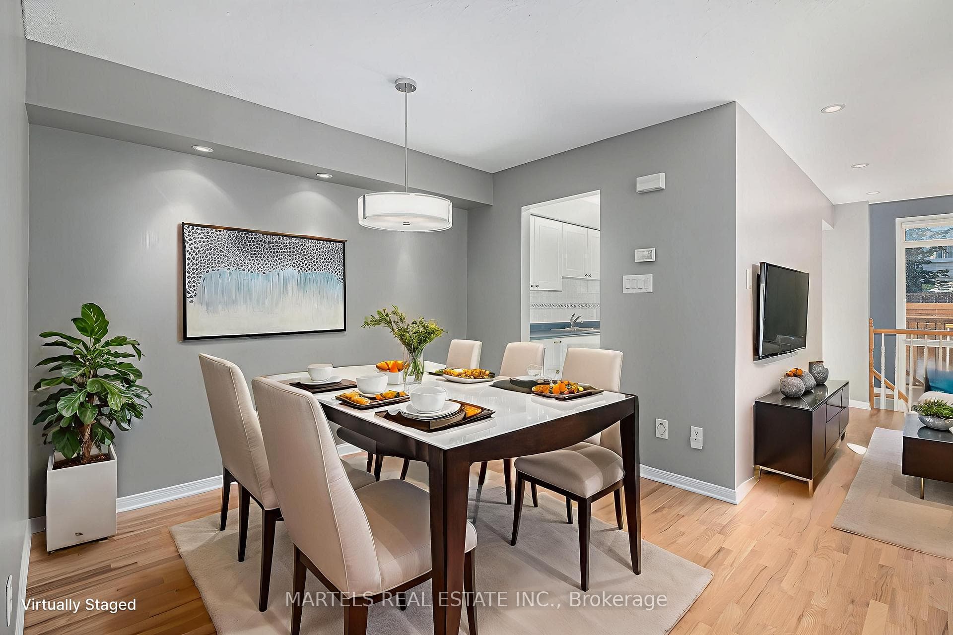 Bright dining room with hardwood floors