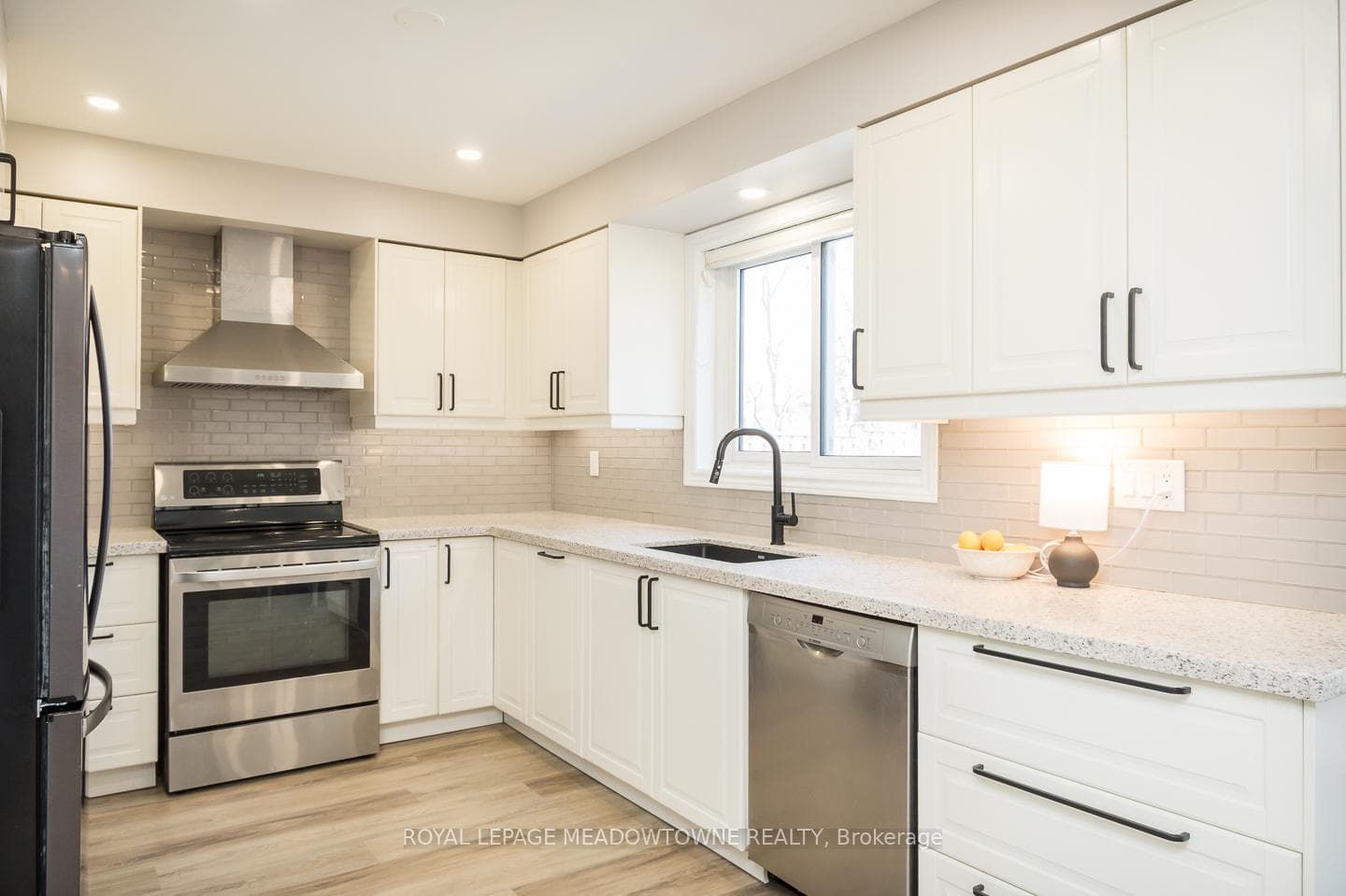 White Cabinets,Stone Counters Upgraded Backsplash