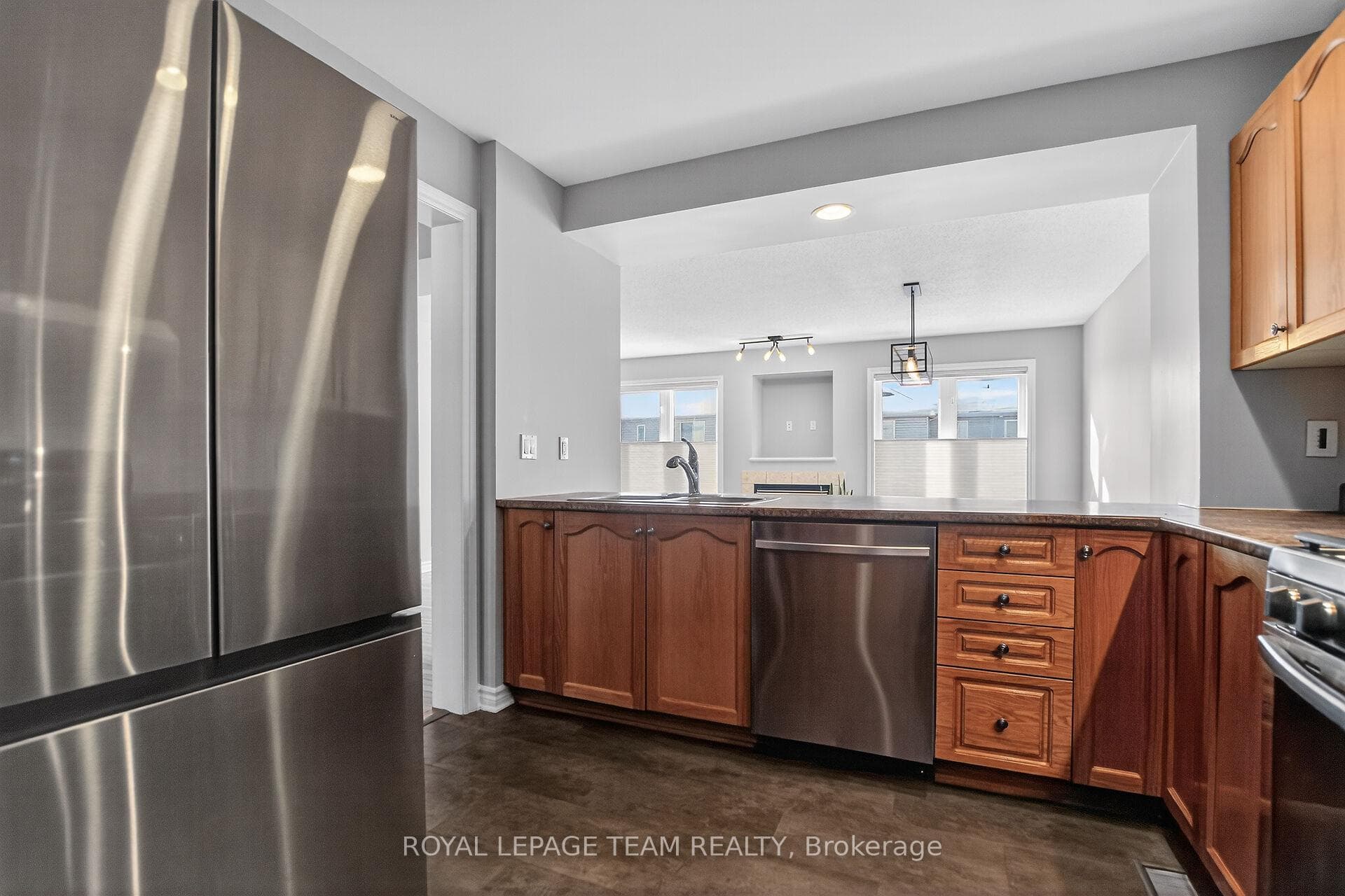 Generous Kitchen overlooks open concept LR/DR.