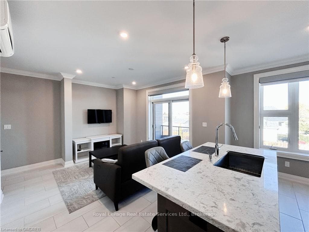 Kitchen featuring decorative light fixtures, a wea