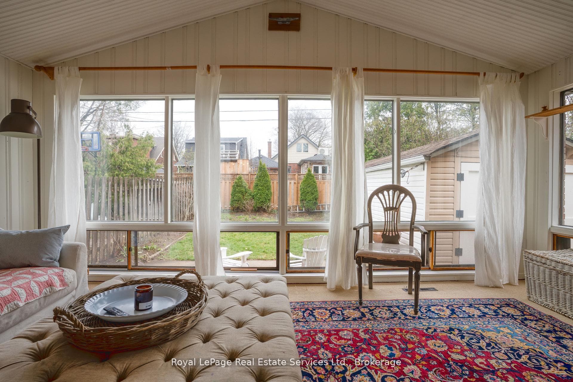 Sun room looking at rear fenced yard