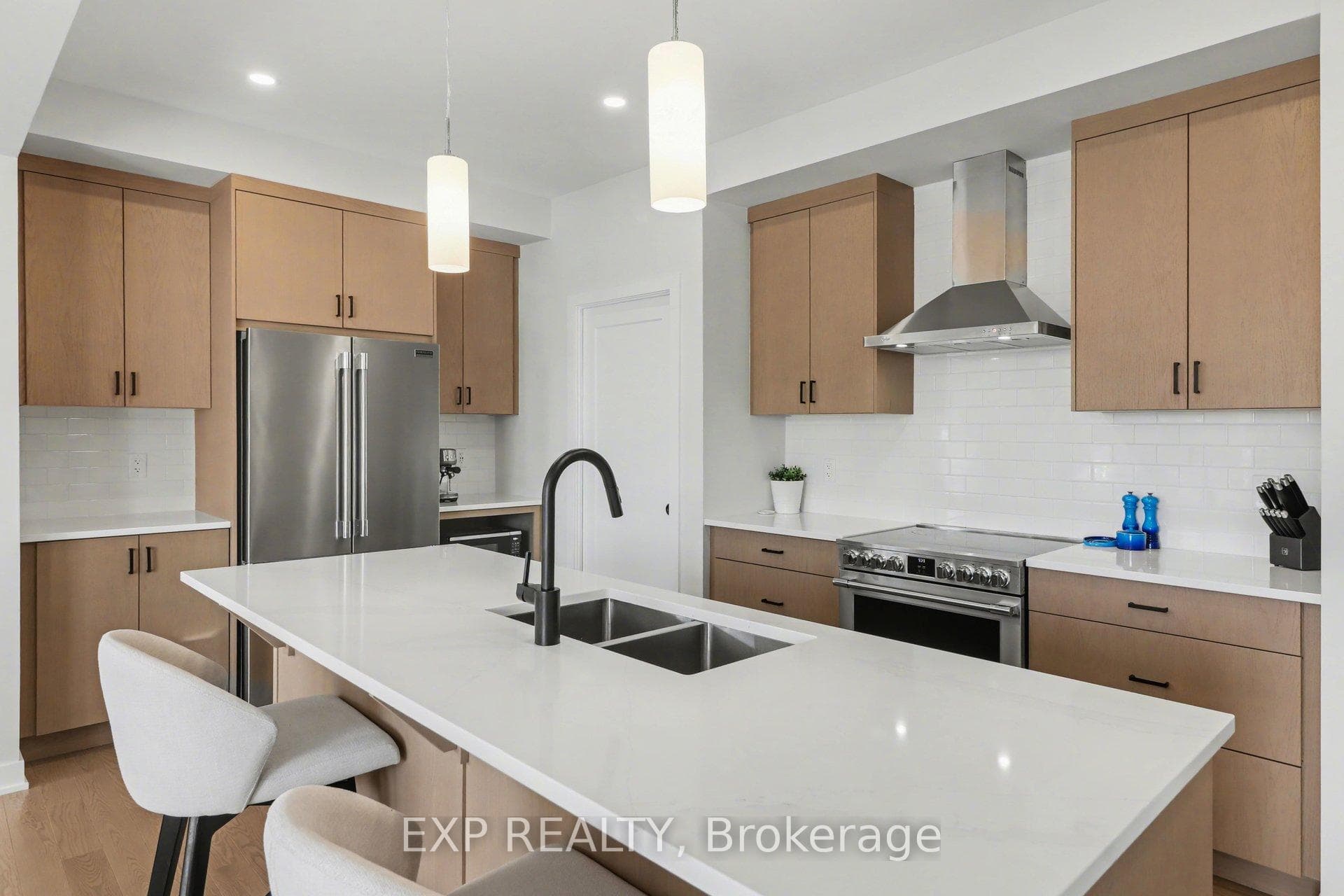 Upgraded quartz countertops & hoodfan.