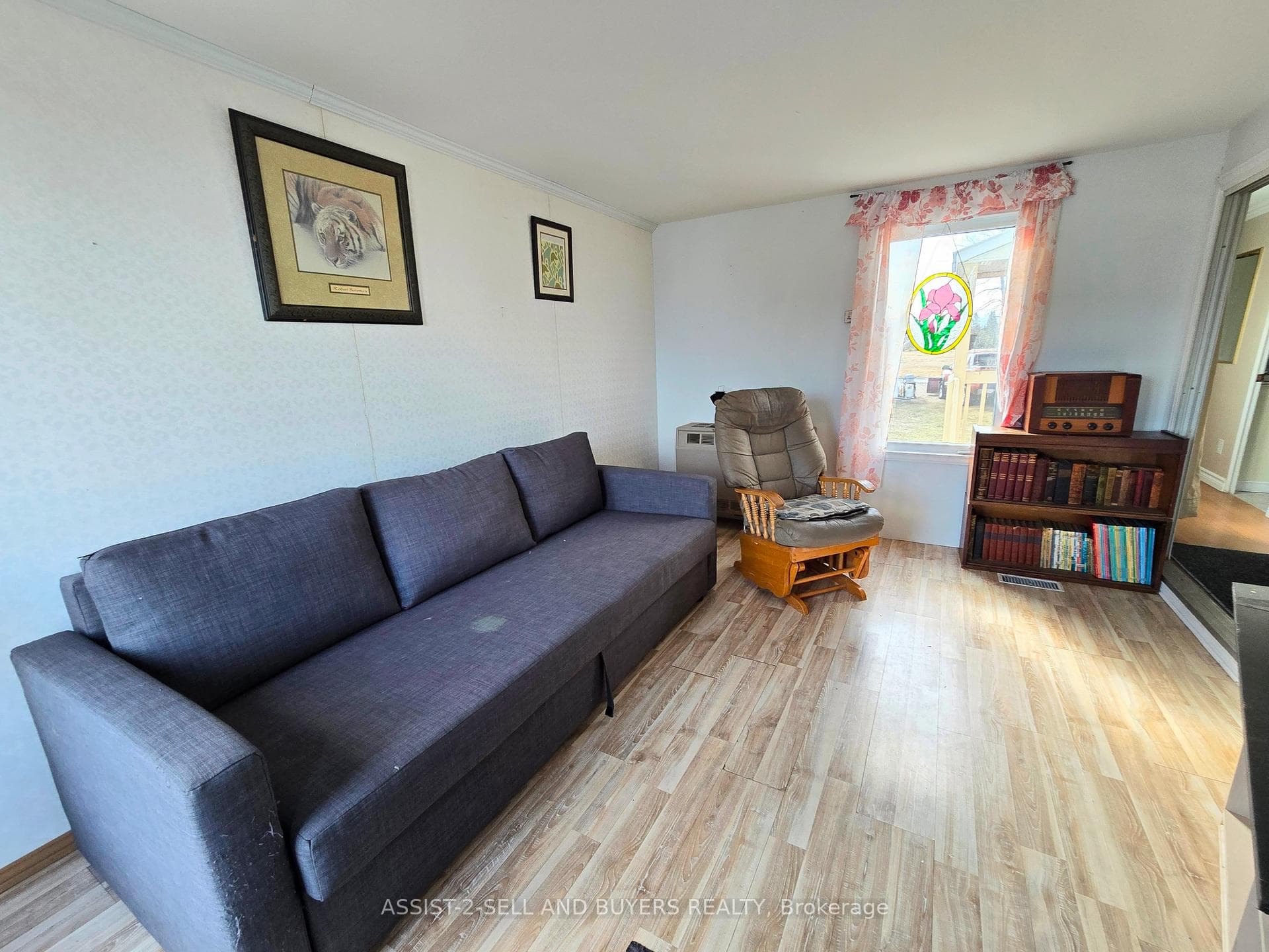 The living room has easy care vinyl flooring.