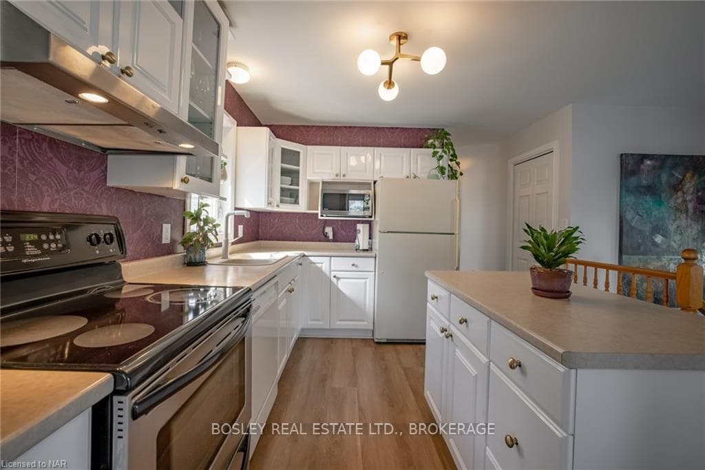 Kitchen with island for additional cabinetry