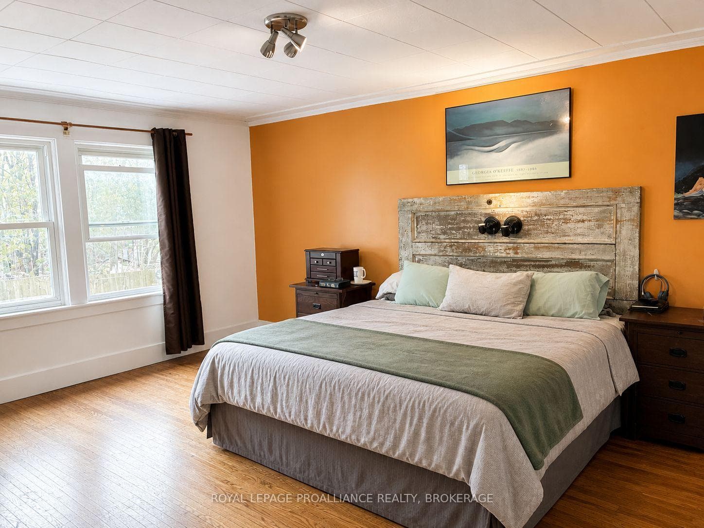 Primary bedroom overlooking yard