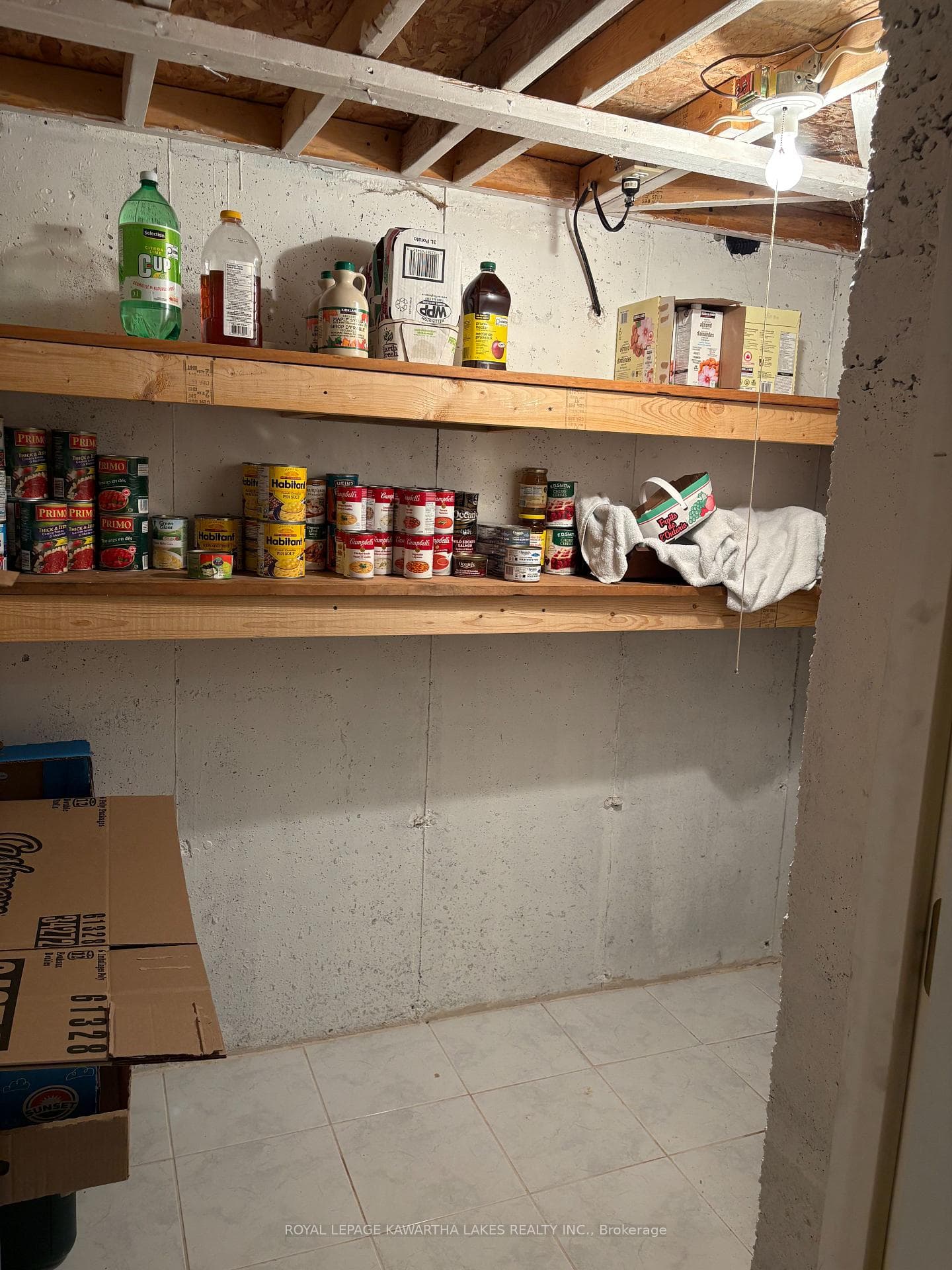 Cold storage area with steel door and tiled floor
