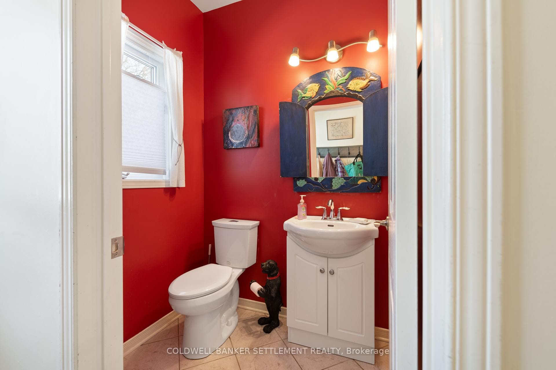 Powder room near back deck, kitchen, laundry