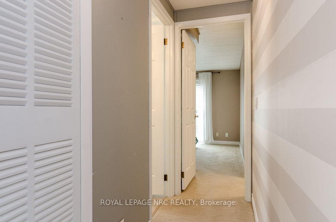 Hallway from kitchen/LR area to baths and P.Bedrm