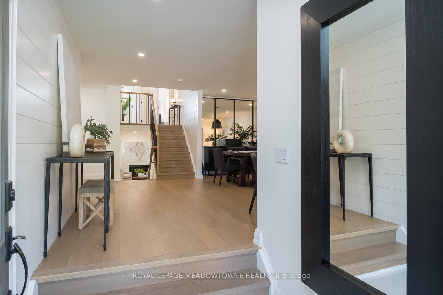 sleek flooring and wrought iron spindles