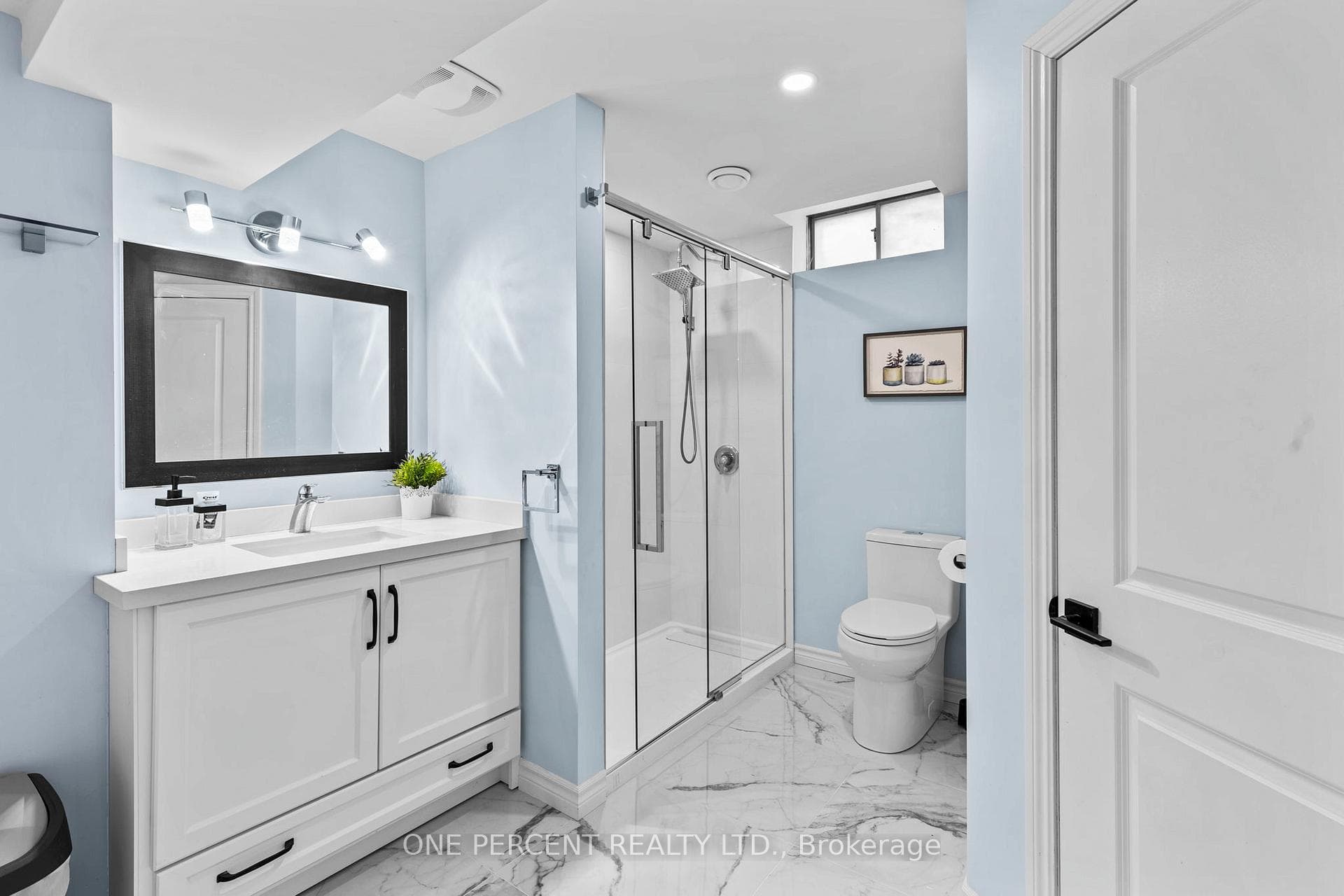 Lower level 3-piece bathroom with glass shower