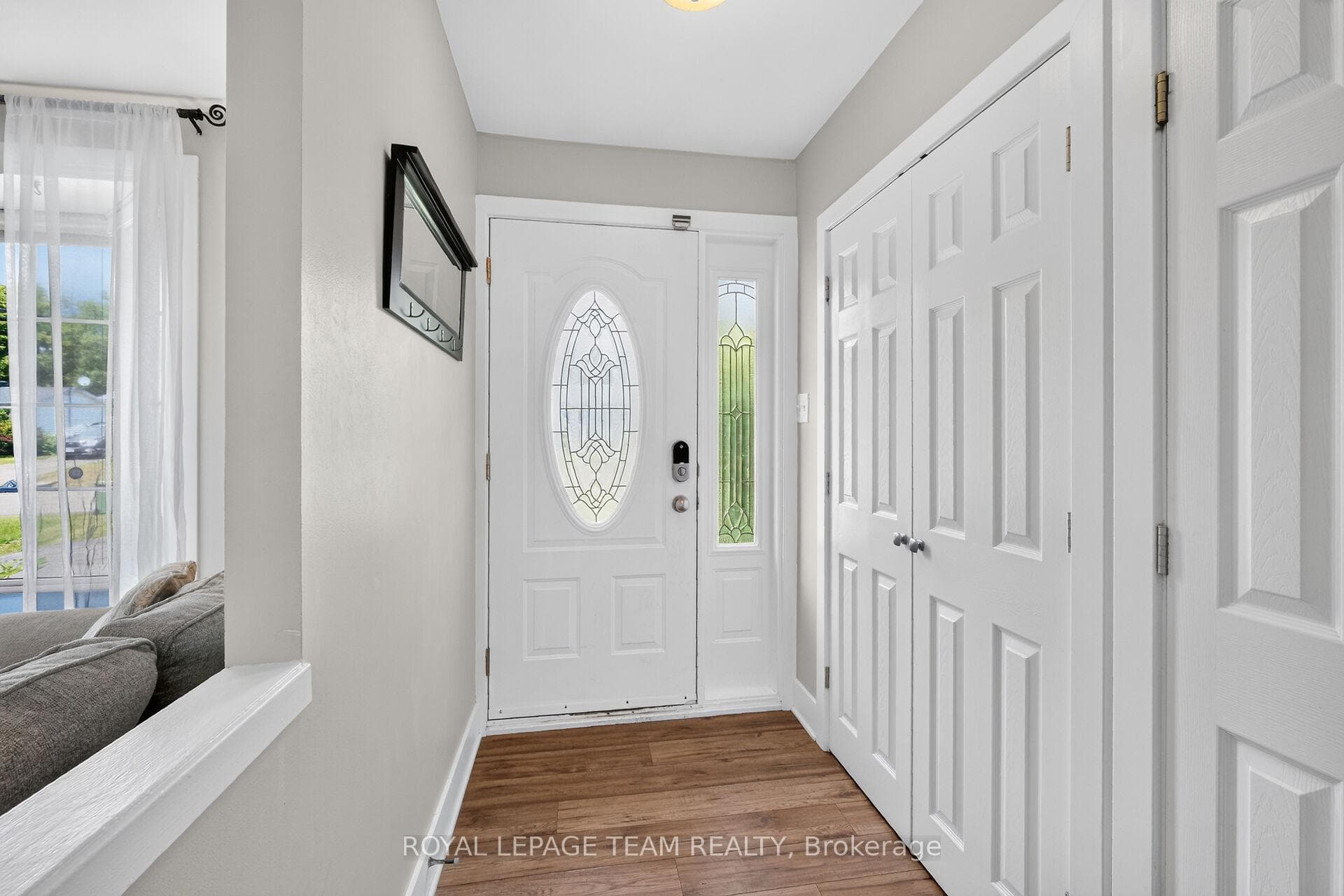 Foyer w/laminate flooring & lots of closet space.