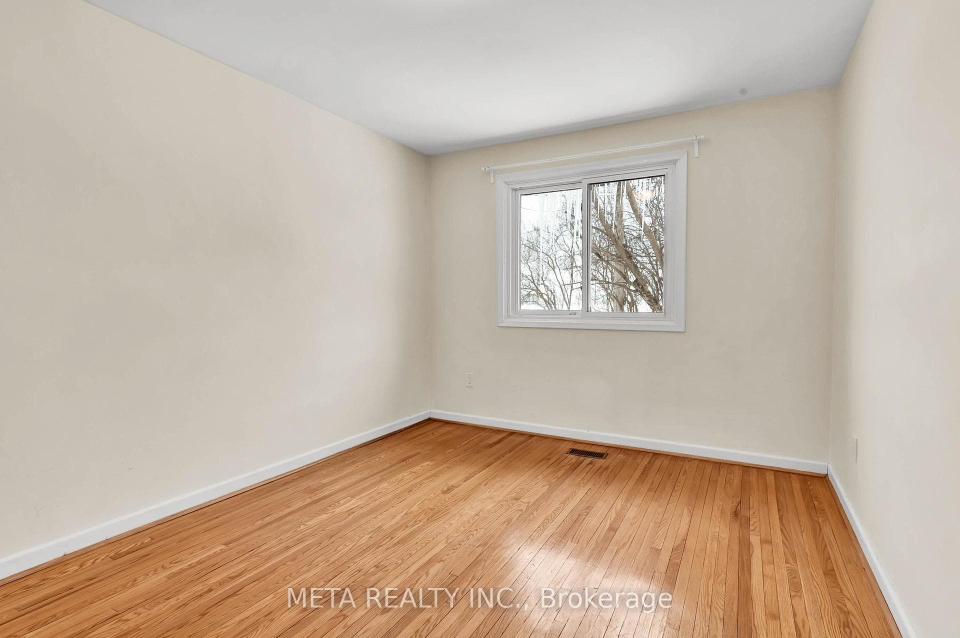 Primary Bedroom Overlooking Backyard