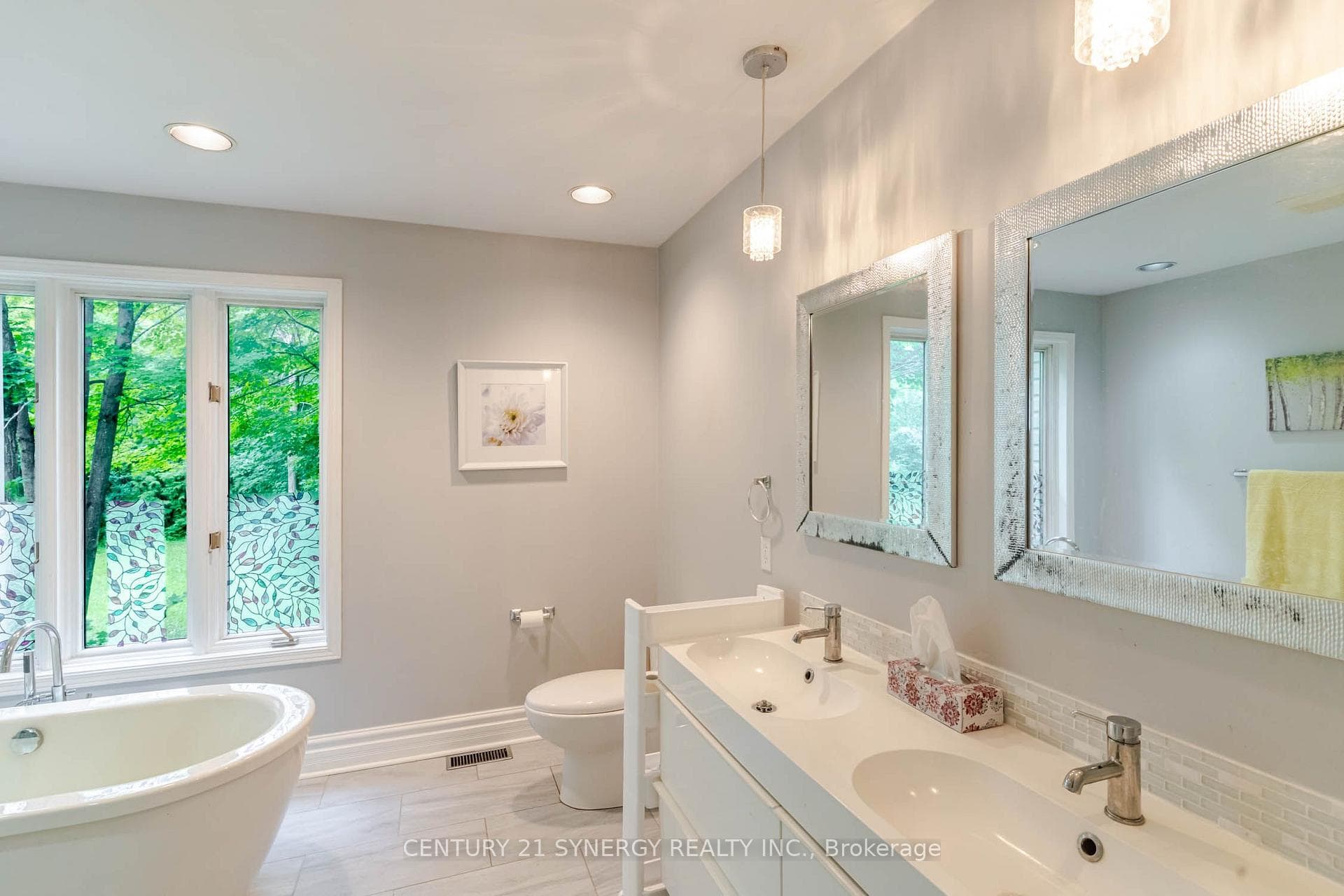 Primary bedroom ensuite with twin sinks