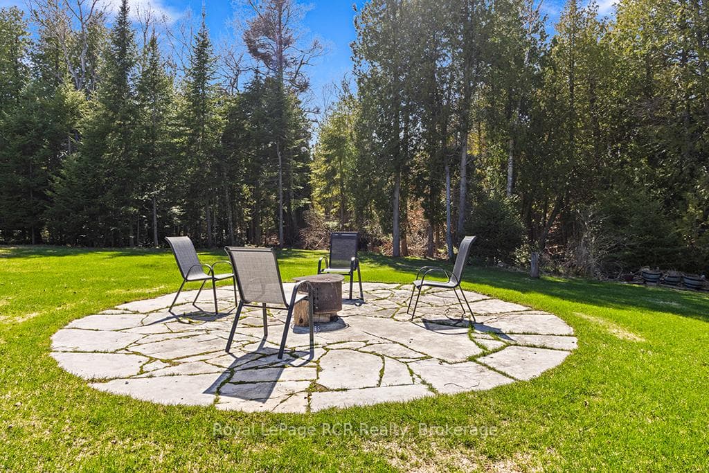 Circular flagstone patio fire-pit area.