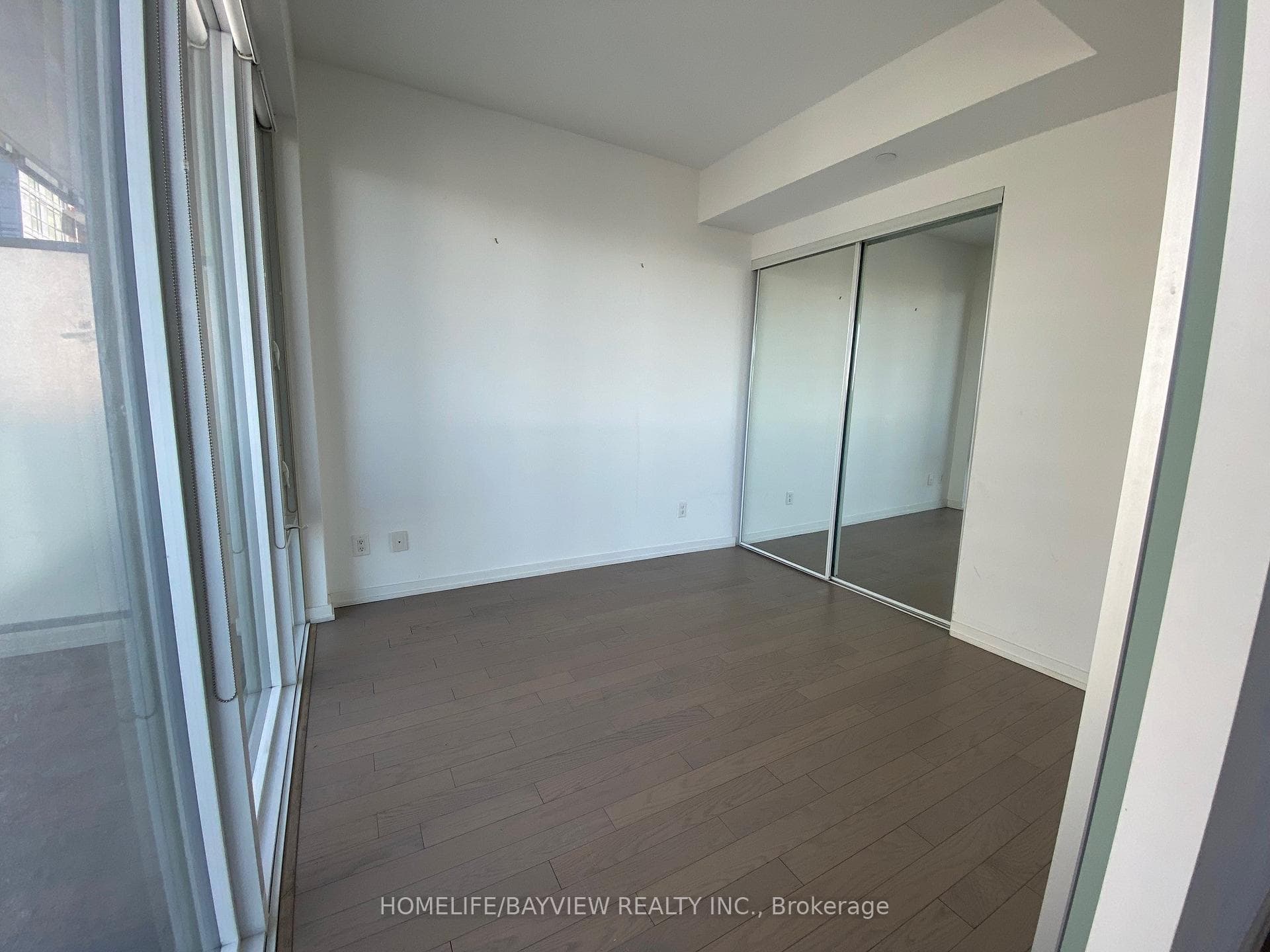 Bedroom-features large closet-mirrored doors