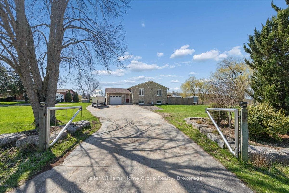 Front of home with large driveway
